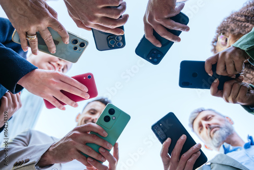 Group of People Holding Smartphones in a Circle