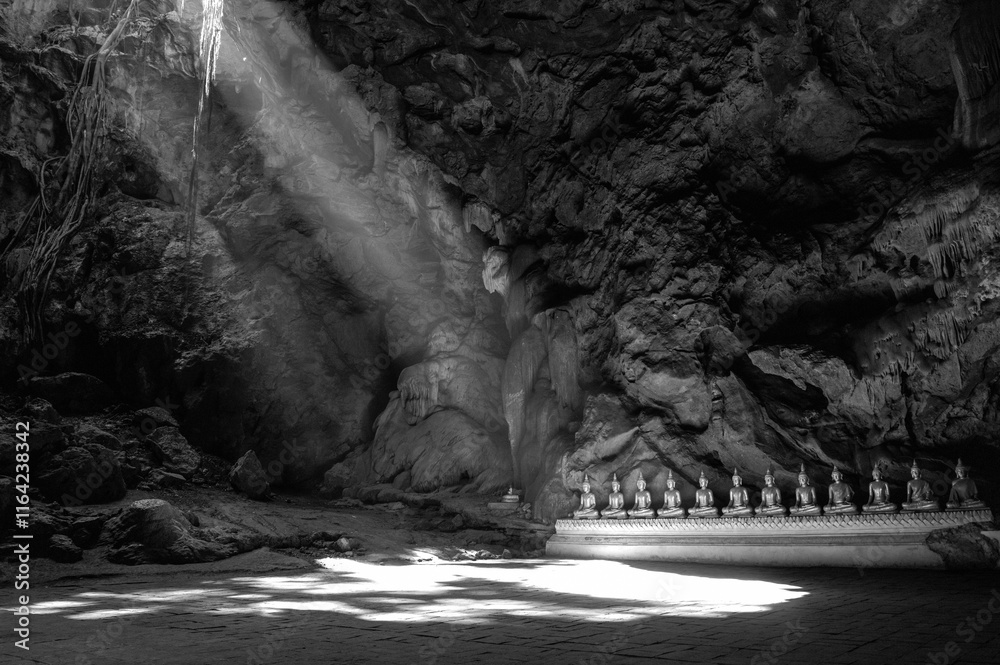 Statue of Buddha in Buddhism Cave in Thum Khao Luang in Phetchaburi Province, Thailand