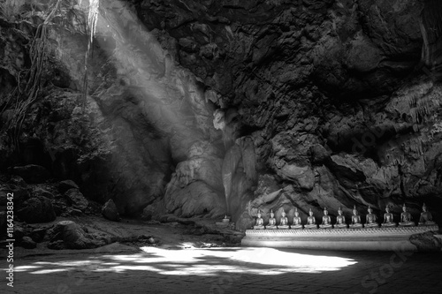 Statue of Buddha in Buddhism Cave in Thum Khao Luang in Phetchaburi Province, Thailand