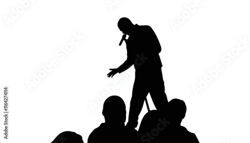 Silhouette of a performer engaging an audience on stage