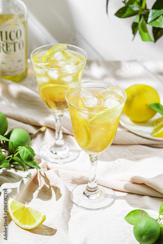 limoncello spritz in a glass on the table with lemons
