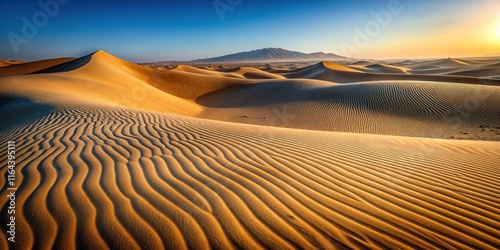 Golden Sandscapes  Desert Dunes at Sunrise with Distant Mountains photo