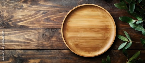 Bamboo round plate on rustic wood background showcasing eco friendly tableware for sustainable dining and decoration purposes photo