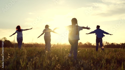 happy family running through field sunset, family child kid mother father running dream, Children Playing Field Sunset, Joyful Kid Outstretched Arms, Family Fun Nature, Carefree Childhood Moments