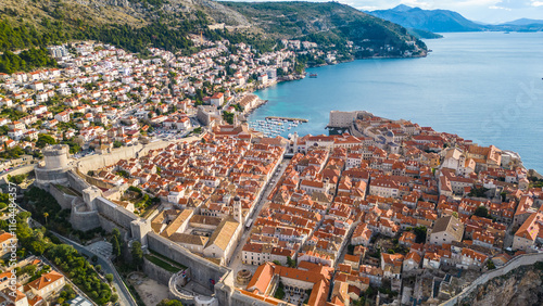 Dubrovnik, the UNESCO World Heritage city on the Adriatic coast of Croatia, captured from a drone, showcases its iconic medieval walls, historic old town, and stunning terracotta rooftops photo
