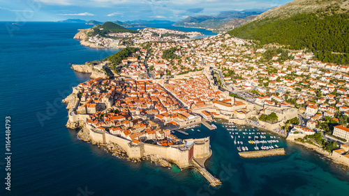 Dubrovnik, the UNESCO World Heritage city on the Adriatic coast of Croatia, captured from a drone, showcases its iconic medieval walls, historic old town, and stunning terracotta rooftops photo