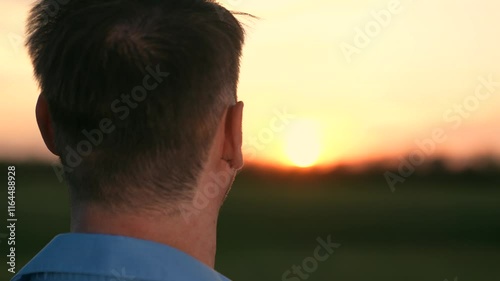 man gazing sunset looking at the sky, silhouette against evening sky man praying god, man look peaceful sunset reflection, serenity nature faith hope, contemplative moment outdoors, enjoying golden
