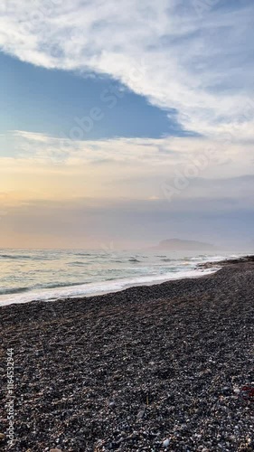 Scenic view of a vibrant sunset illuminating the ocean creating an idyllic coastal atmosphere