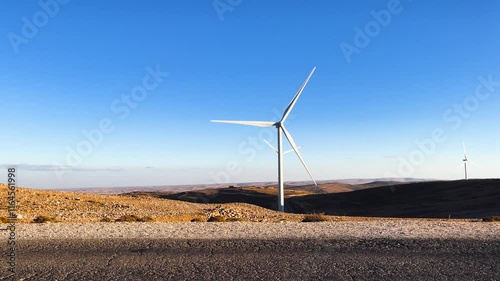 Still shot of Wind Turbines in the Desert generating electrical power