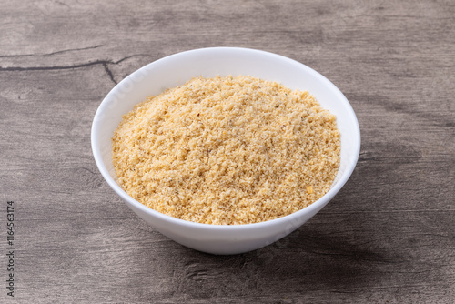 Farofa, typical brazilian manioc flour side dish over wooden table