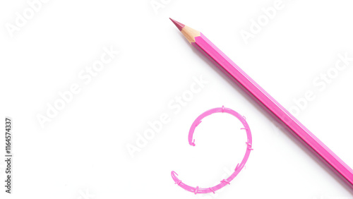 Pink pencil on white background photo