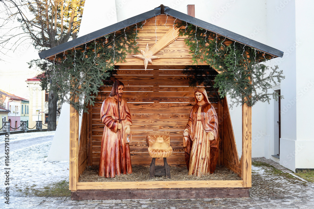STARA LUBOVNA, SLOVAKIA - DECEMBER 28, 2024: Traditional Christmas decorations, nativity scene with old wooden figurines.