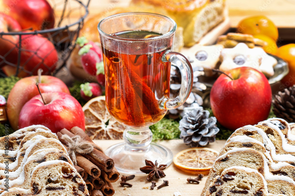 Glass of Christmas tea with cloves and cinnamon.
