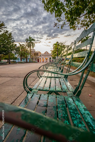 Many old benches in the Jose Marti Park in Cienfuegos, Cuba photo