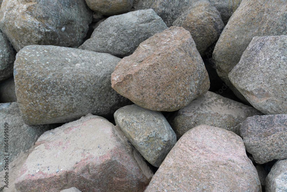 Pile of stones: A heap of natural boulders of various sizes and shapes stacked on top of each other. The overall composition of the stones looks chaotic but reflects natural harmony and strength. Pile of stones: A heap of natural boulders of various sizes and shapes stacked on top of each other. The overall composition of the stones looks chaotic but reflects natural harmony and strength.