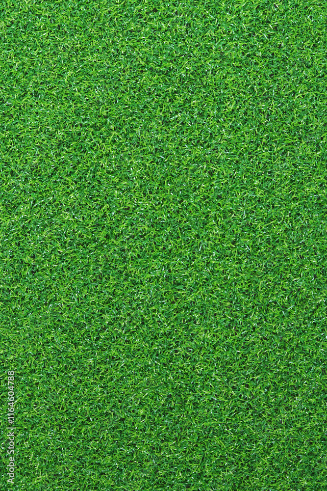 Fototapeta premium Artificial grass, covering. Artificial green grass mat, top view. Texture. Background. Artificial turf, surface made of synthetic fibers. Flat green grass texture background. Short grass