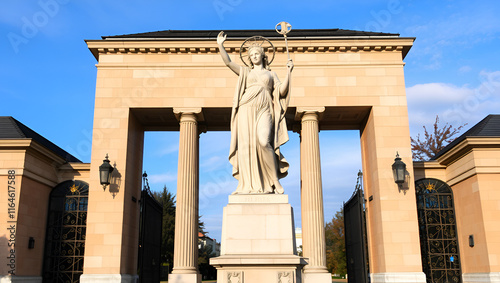 Warsaw, Poland. Statue of Urania, Greek muse of astronomy and astrology, at the entrance gate to the main campus of the University of Warsaw photo