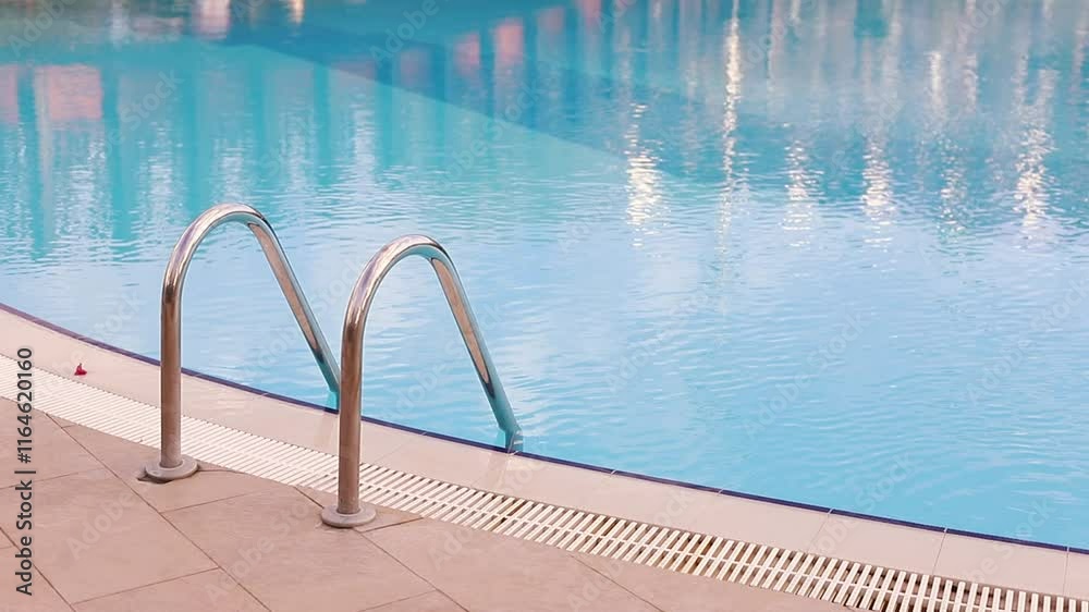 Ladder at blue water pool, swimming in pool during vacations, swimming ban, lifeguard work Ladder at blue water pool, swimming in pool during vacations, swimming ban, lifeguard work