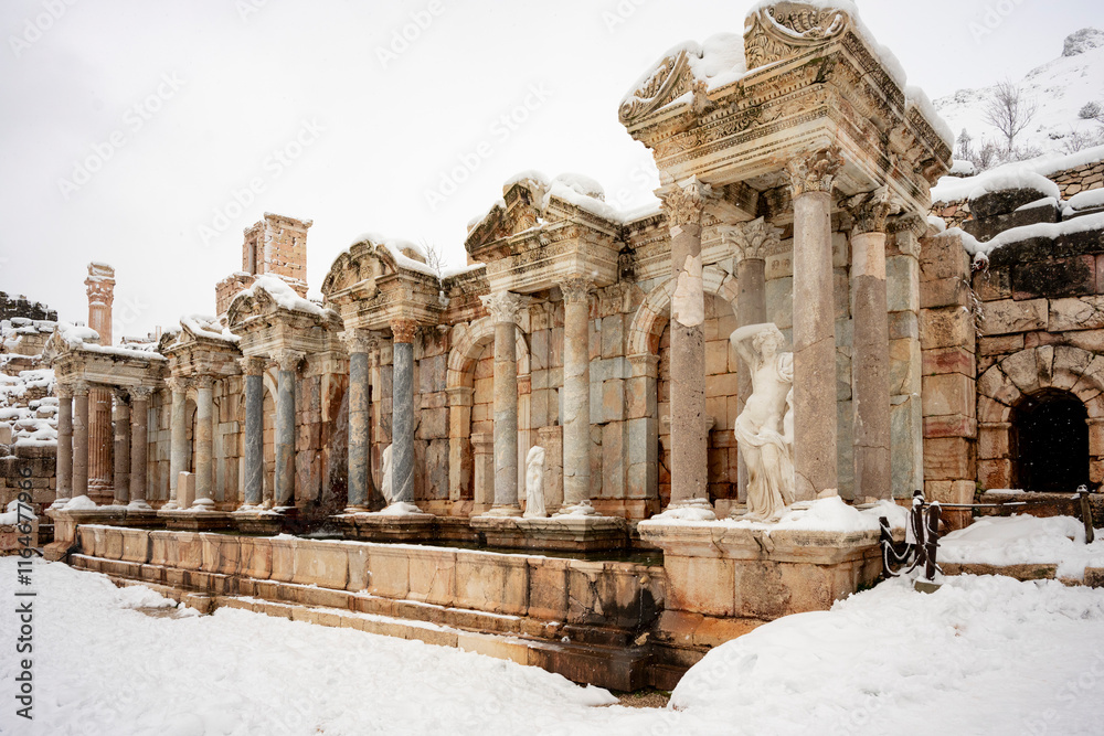 Obraz premium .To visit the sprawling ruins of Sagalassos, high amid the jagged peaks of Ak Dag, is to approach myth: the ancient ruined city set in stark . Sagalassos Ancient City under the snow on a winter day.