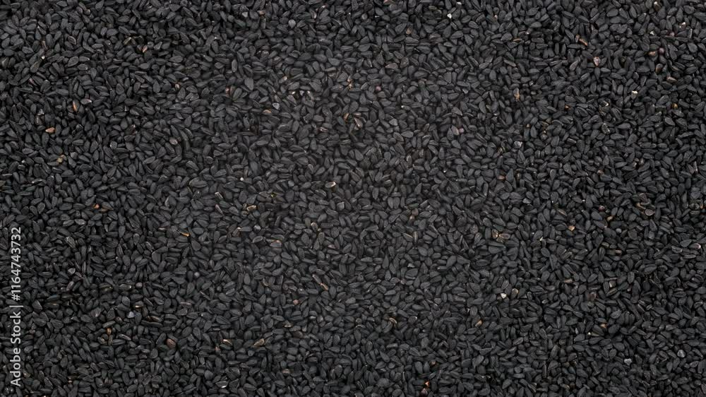 Top down view. Heap of dry black cumin seeds, slider shot. Ingredients, food seasoning, cooking, spices, flavor concepts. 4k Top down view. Heap of dry black cumin seeds, slider shot. Ingredients, food seasoning, cooking, spices, flavor concepts. 4k