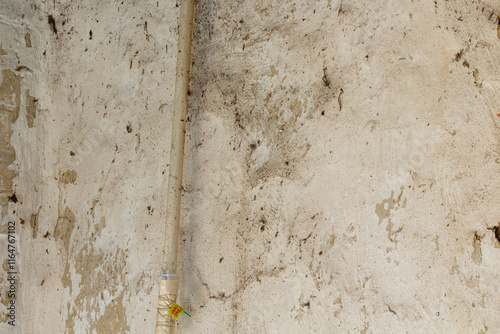 gas meter and pipes on the old wall in the house