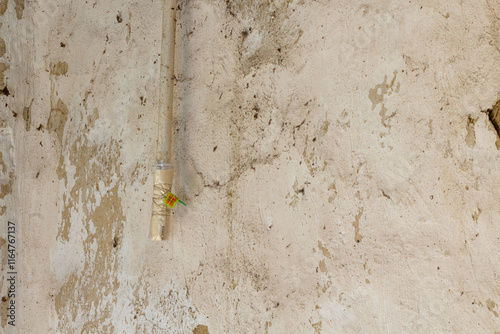 gas meter and pipes on the old wall in the house