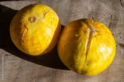 ripe cracked yellow small melon spoiled melon