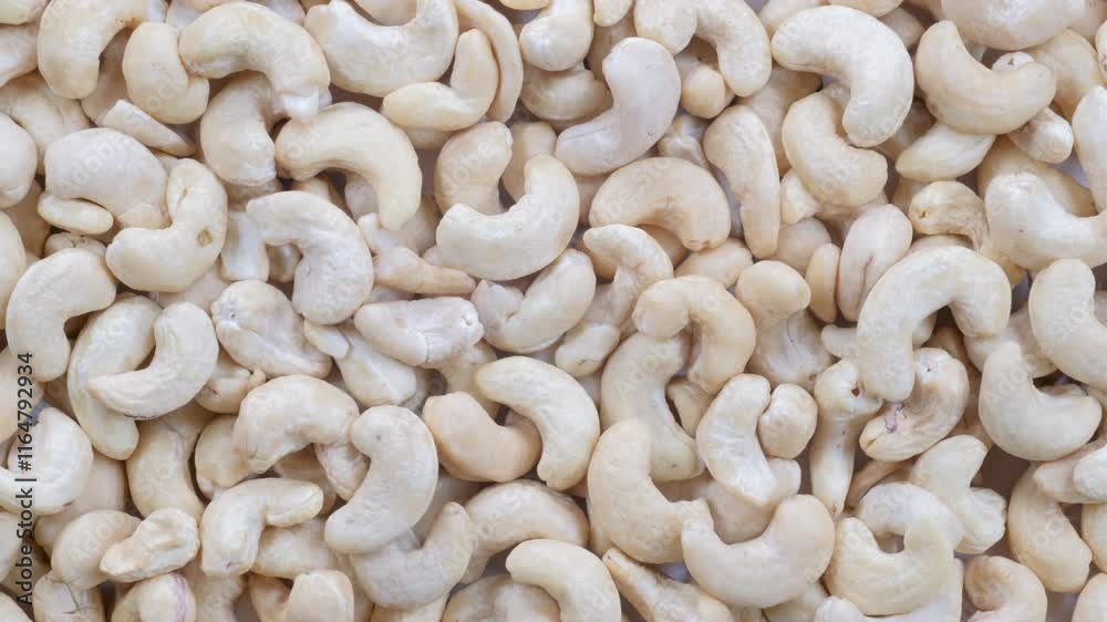 Top down view, slider shot of fresh cashew nuts in a heap. Food, nutrition, healthy eating, snacks, ingredient concepts. 4k Top down view, slider shot of fresh cashew nuts in a heap. Food, nutrition, healthy eating, snacks, ingredient concepts. 4k
