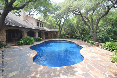 Stone House, Flagstone Patio, and Freeform Swimming Pool