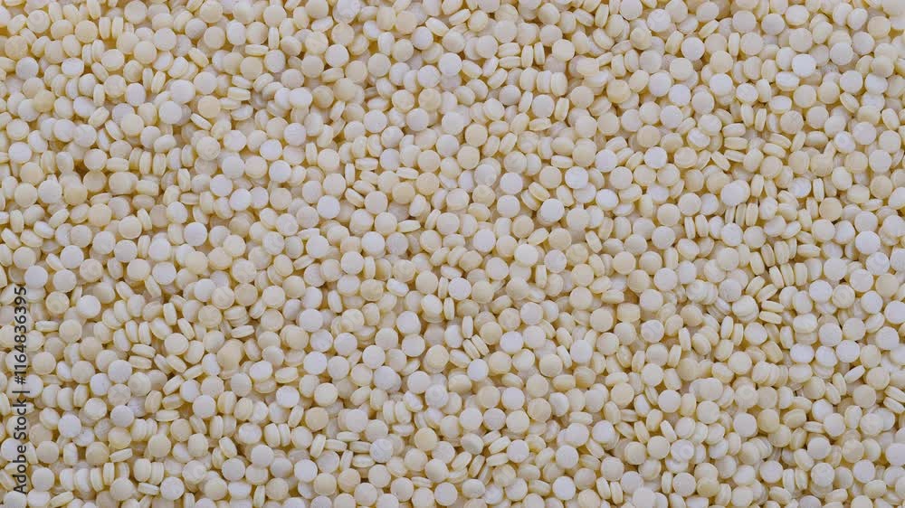 Top down view. Heap of raw dry couscous (kuskus) groats, cereals. Slider shot. Texture of grains. Cooking, whole grains, traditional cuisine, food-related themes. 4k Top down view. Heap of raw dry couscous (kuskus) groats, cereals. Slider shot. Texture of grains. Cooking, whole grains, traditional cuisine, food-related themes. 4k
