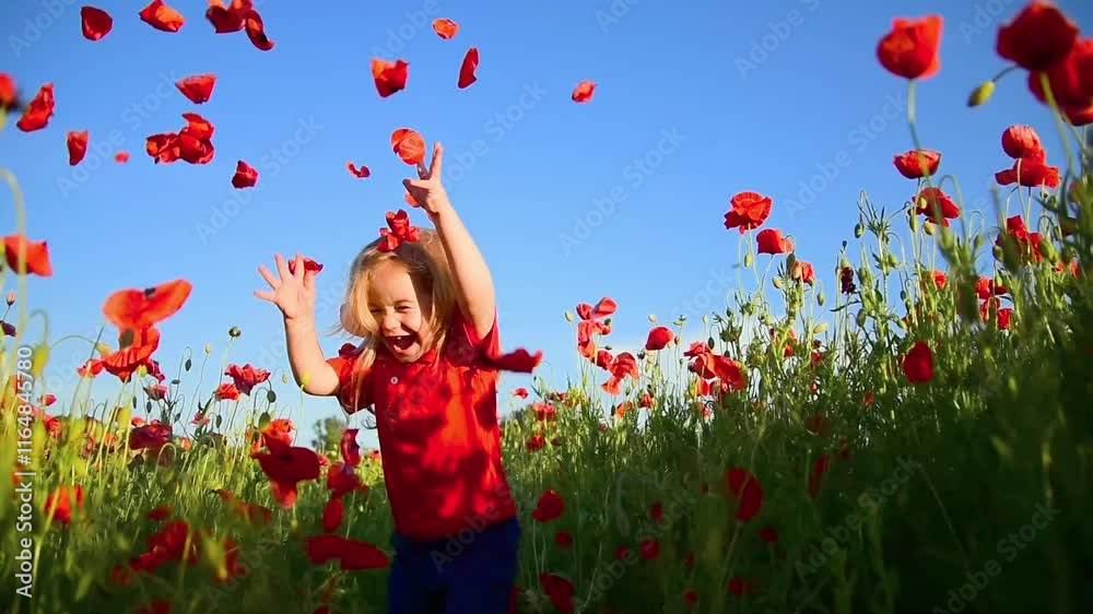 Happy kid enjoying spring. Child baby in spring meadow of blossom poppy flowers. Little kid and summer play nature. Baby throwing poppy petals. Spring vibes. Emotional kid portrait.