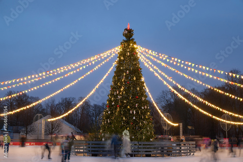 A delightful festive ice skating rink adorned with a beautiful Christmas tree and sparkling lights