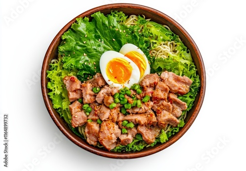 Delicious bowl of noodles with pork, egg, and lettuce.