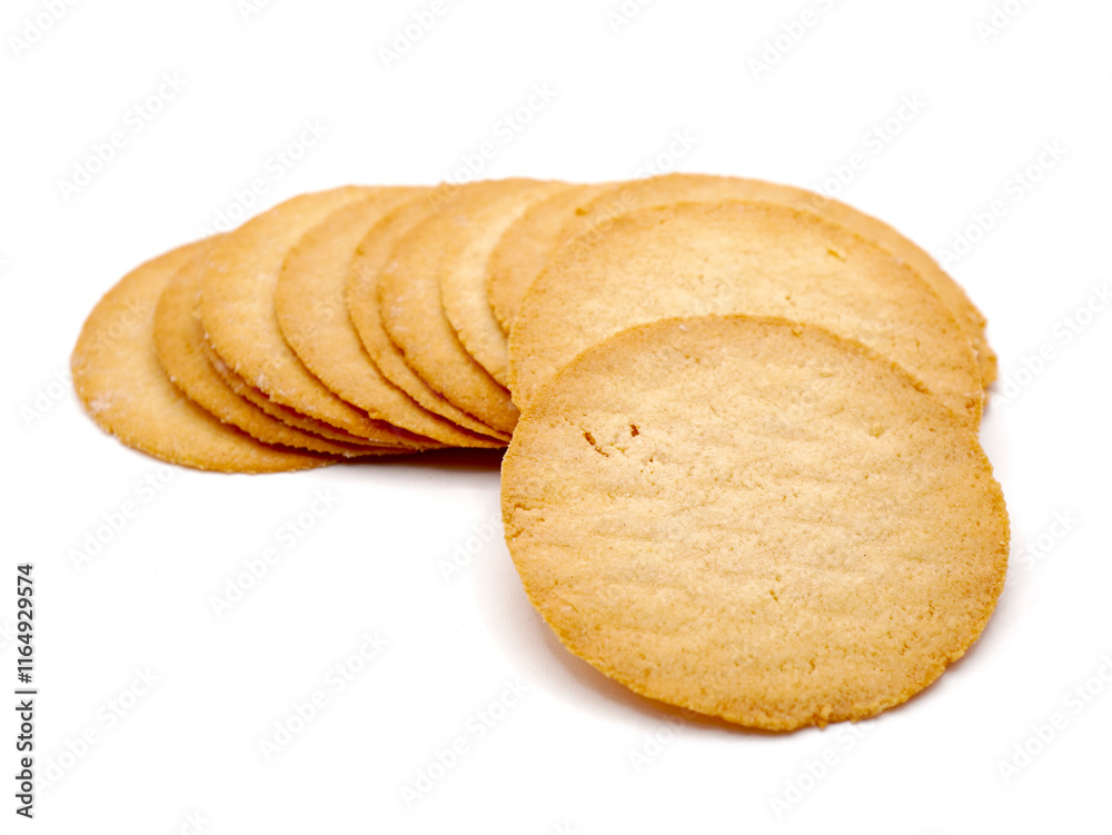 A close-up image of baked potato crisps isolated on a white background. Showcasing their golden-brown texture and thin A close-up image of baked potato crisps isolated on a white background. Showcasing their golden-brown texture and thin