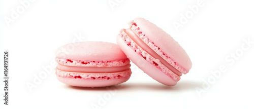 Two delicate pink macarons with creamy filling, perfect for dessert or special occasions. photo