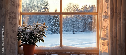 Cozy window offering a serene view of a snowy landscape with warm sunlight illuminating the scene inviting tranquility and comfort photo