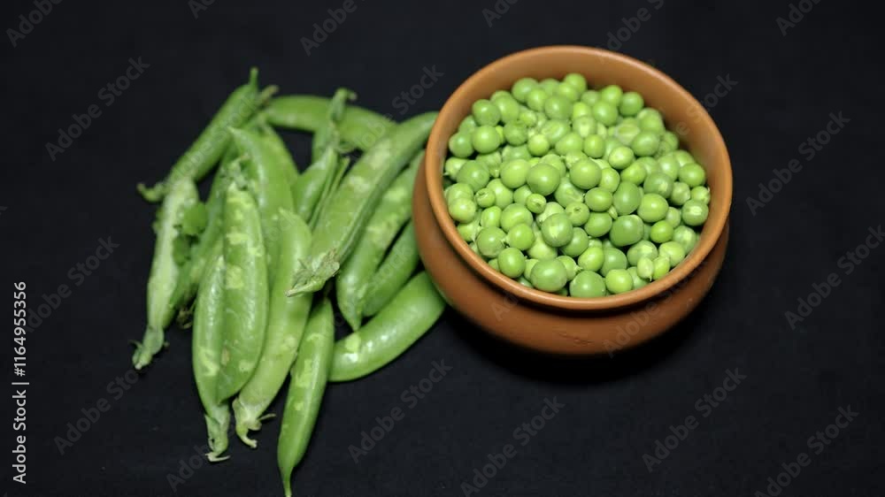 Fresh Green Peas Raw and Peeled Close-Up on Black Background studio shot Fresh Green Peas Raw and Peeled Close-Up on Black Background studio shot