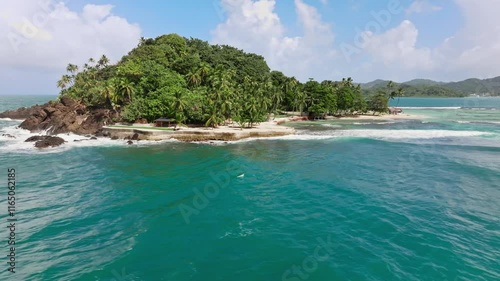 Drone footage sorrounding an island in the caribbean photo