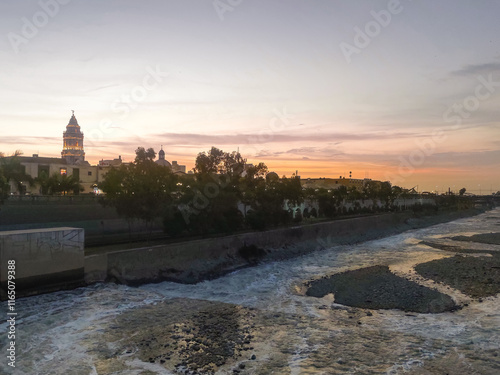 Sunset over the historic Trujillo Bridge and the Rimac River in Lima, Peru