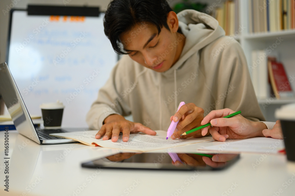 Asian male student studying with tutor at home. Education, knowledge and tutoring concept Asian male student studying with tutor at home. Education, knowledge and tutoring concept