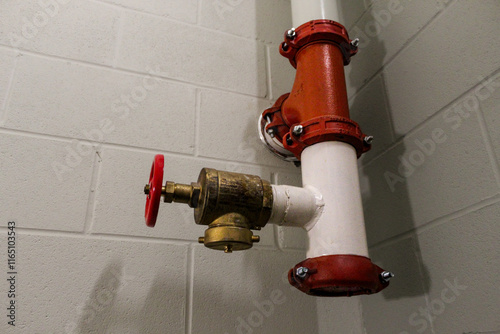 fire hose standpipe system strategy in stairwell with concrete wall background fire safety efficiency awareness