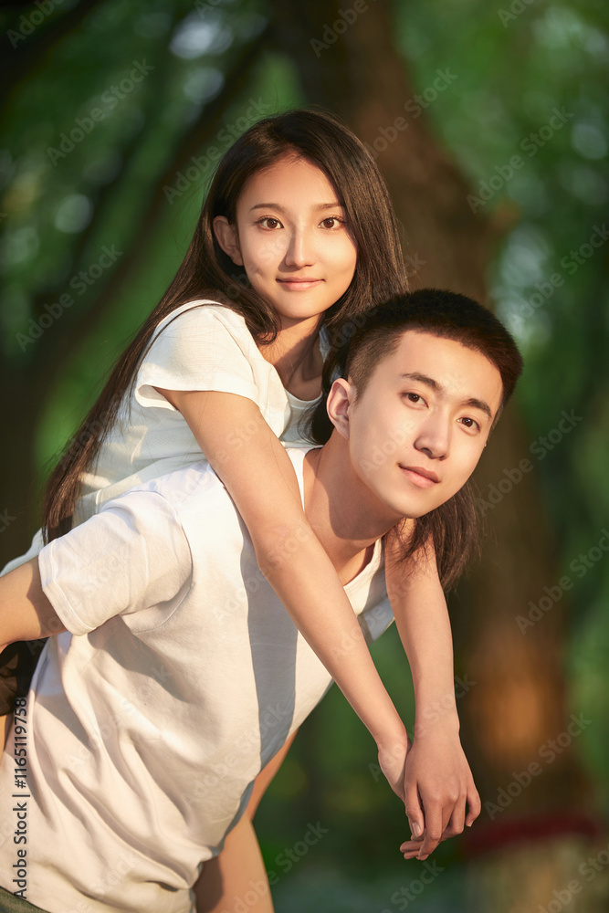 Fototapeta premium Loving young couple outdoors at sunset