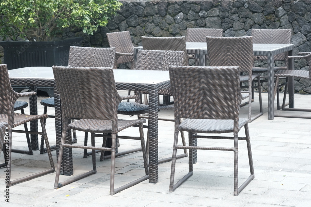 rattan and wooden chair table set. natural tropical style terrace. a place to relax. rattan and wooden chair table set. natural tropical style terrace. a place to relax.