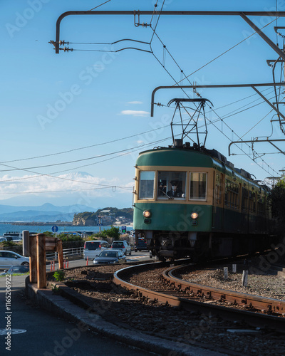 Enoshima Electric Railway of Kamakura with Mount Fuji in the distance, Kanagawa, Japan