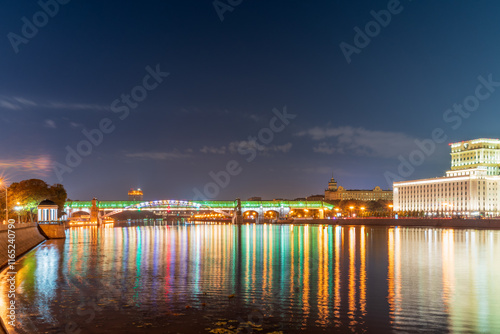 Pushkinskiy bridge with night illumination. Bridge to Gorky Park. photo