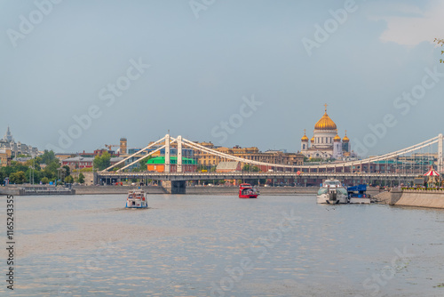 Photography Cruise ship sails on the Moscow river in Moscow city center, popular place for walking