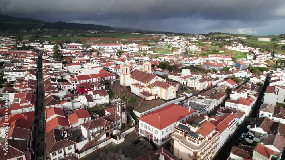 Aerial arc view of historic Santa Cruz Church in coastal town Praia da Vitoria Aerial arc view of historic Santa Cruz Church in coastal town Praia da Vitoria