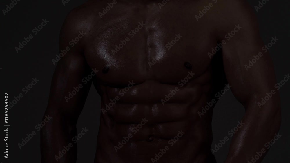 Strong male model, sexy sports athlete fitness personal trainer. Perfect abs, shoulders, and chest. Man with naked torso showing six pack abs. Fitness man showing muscular fitness body.