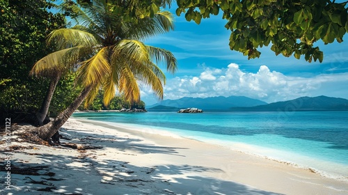 Tropical beach with palm trees, white sand and turquoise water in nosy iranja island, madagascar photo