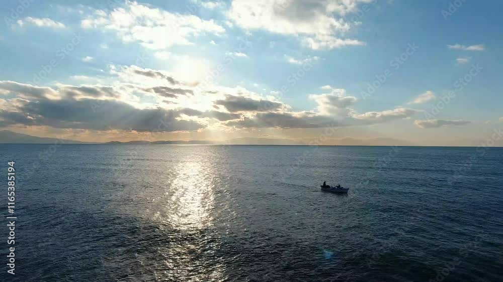 Fishermen throwing net into the sea at sunset 4K Drone Shot-4 Fishermen throwing net into the sea at sunset 4K Drone Shot-4